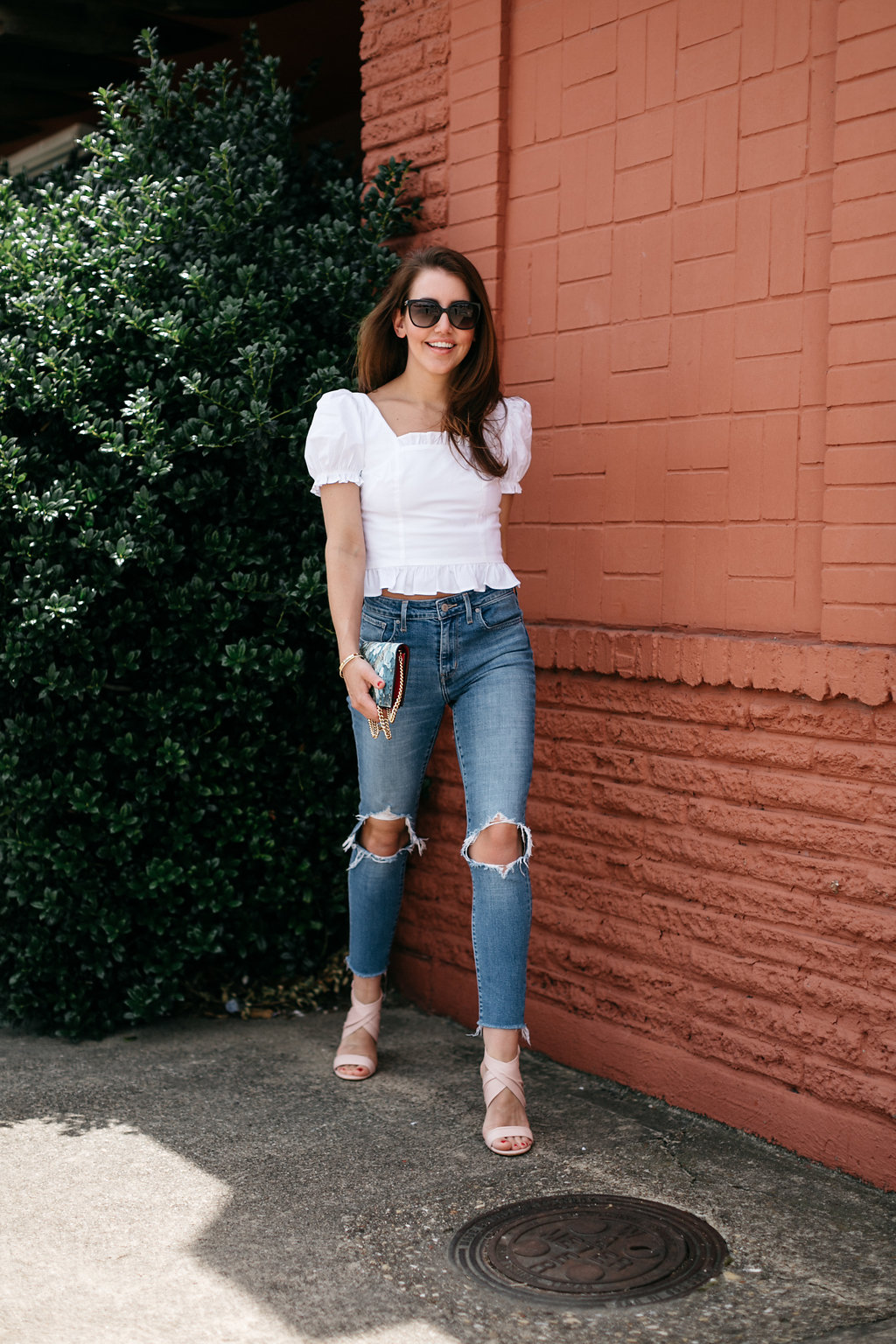 amy havins wears jeans and a white blouse.