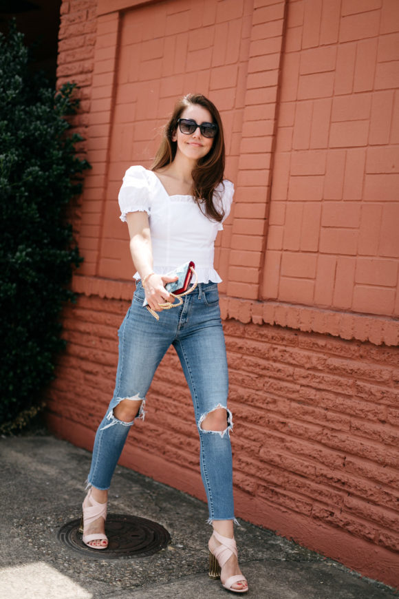 amy havins wears jeans and a white blouse.