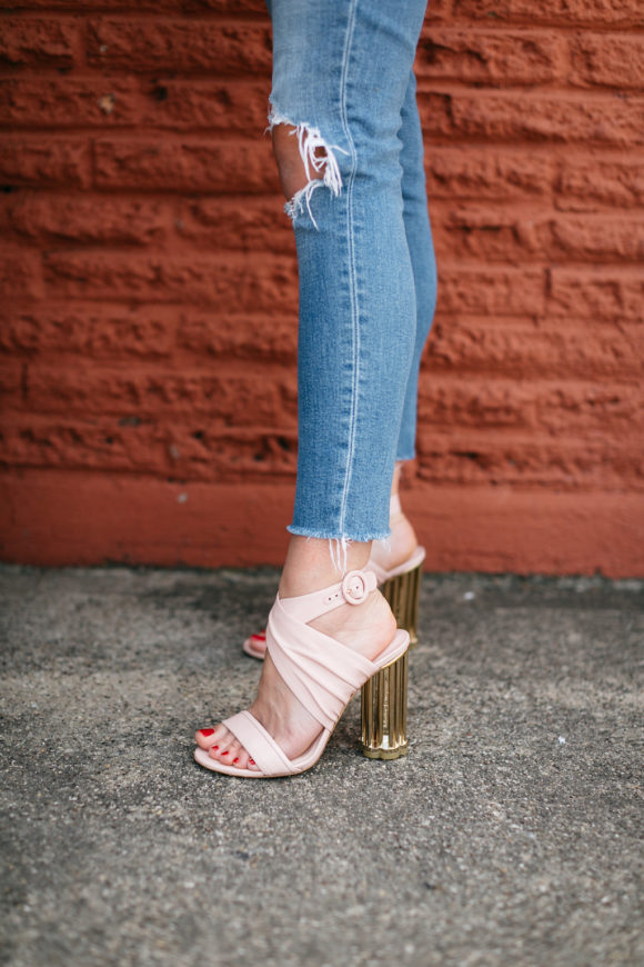 amy havins wears jeans and a white blouse.