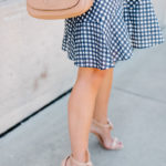 Amy Havins wears a gingham dress.