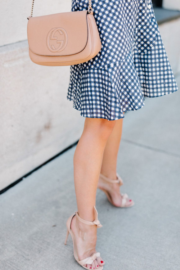 Amy Havins wears a gingham dress.