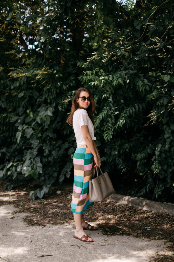 Amy Havins wears a striped tibi skirt and white tee shirt.