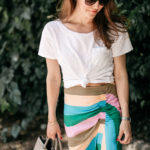 Amy Havins wears a striped tibi skirt and white tee shirt.