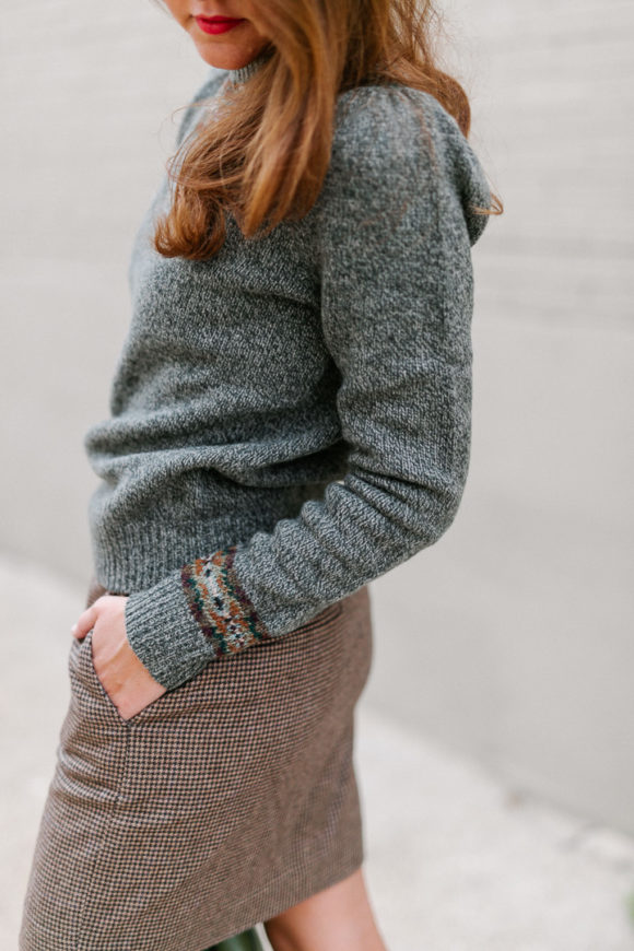 Amy Havins wears a Ralph Lauren Skirt and sweater combination.