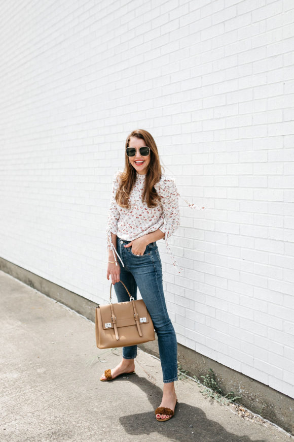 Amy Havins wears jeans and a blouse.