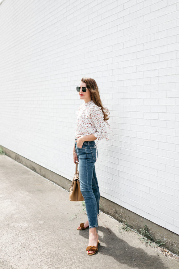 Amy Havins wears jeans and a blouse.