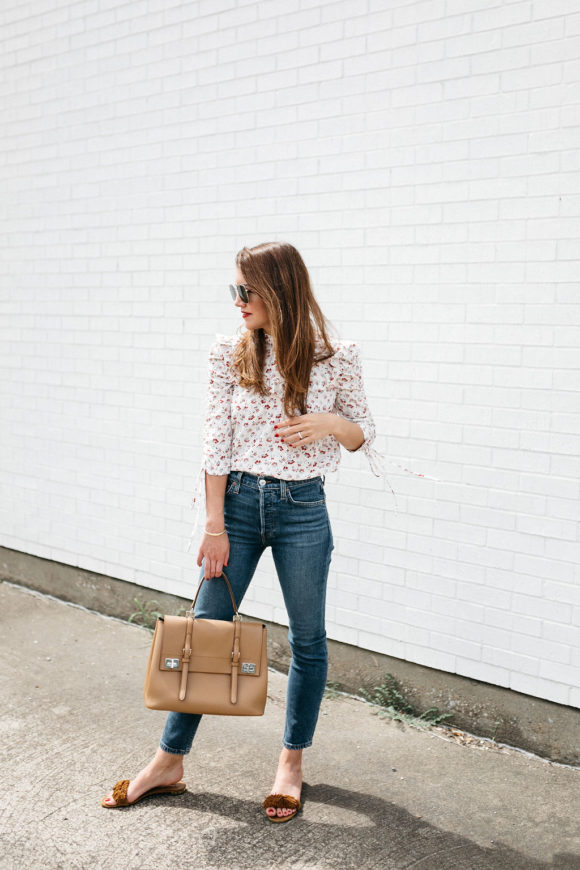 Amy Havins wears jeans and a blouse.