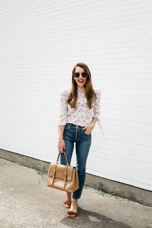 Amy Havins wears jeans and a blouse.