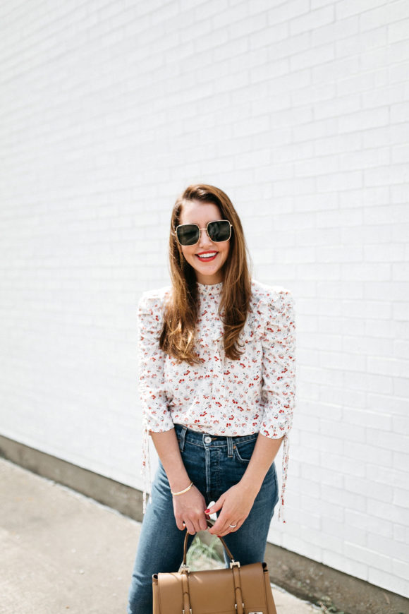 Amy Havins wears jeans and a blouse.