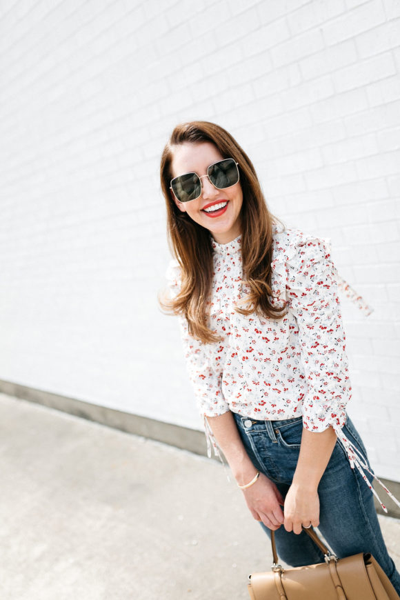 Amy Havins wears jeans and a blouse.