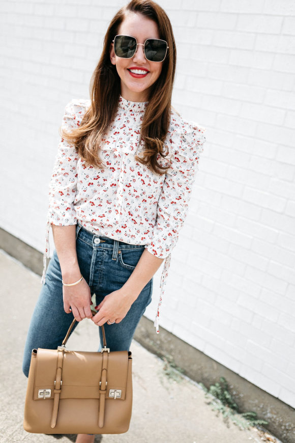 Amy Havins wears jeans and a blouse.