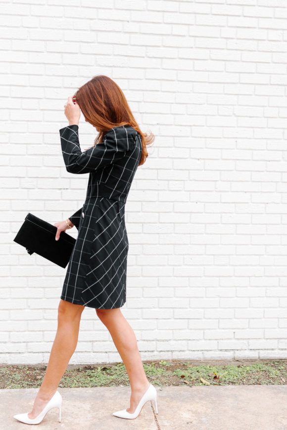 Amy Havins wears a black contrast plaid shoshanna dress.