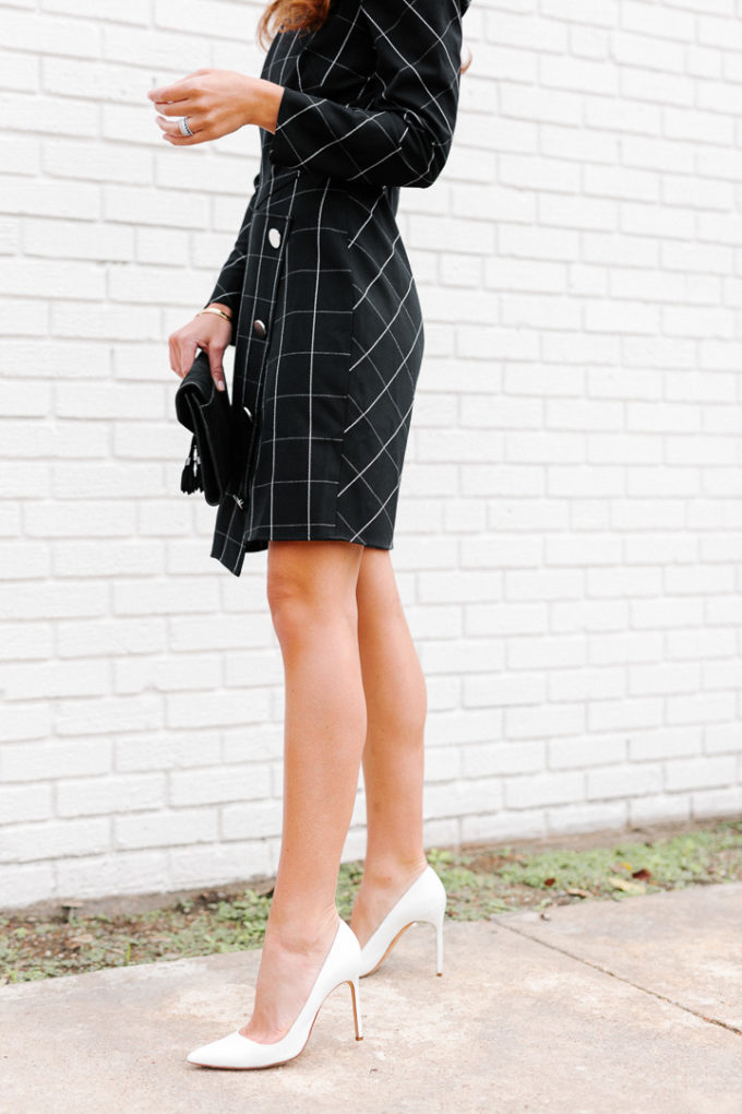 Amy Havins wears a black contrast plaid shoshanna dress.