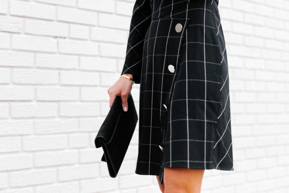 Amy Havins wears a black contrast plaid shoshanna dress.