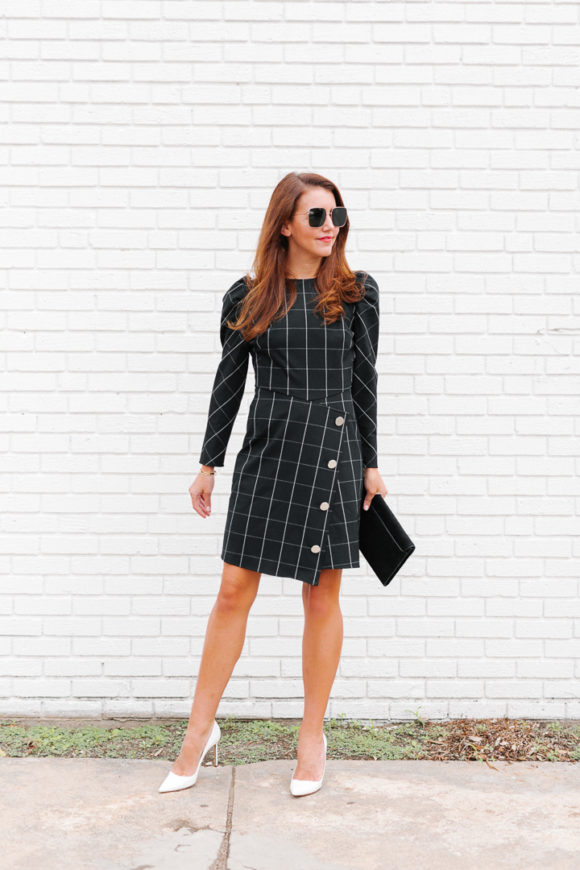 Amy Havins wears a black contrast plaid shoshanna dress.