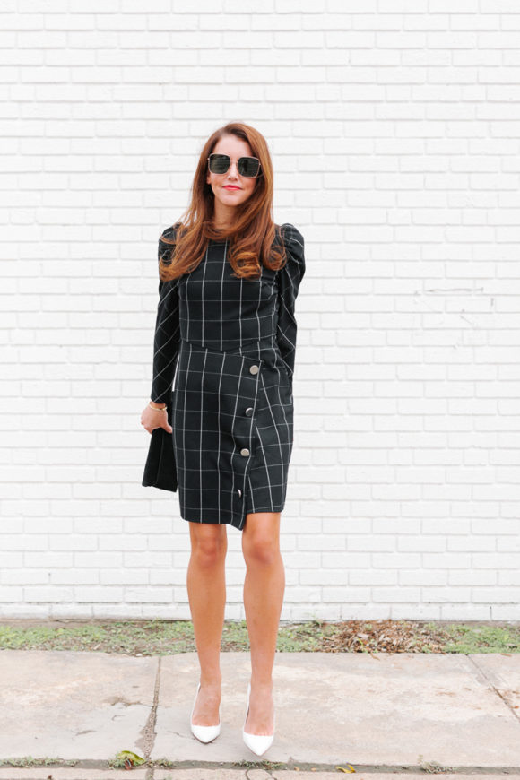 Amy Havins wears a black contrast plaid shoshanna dress.