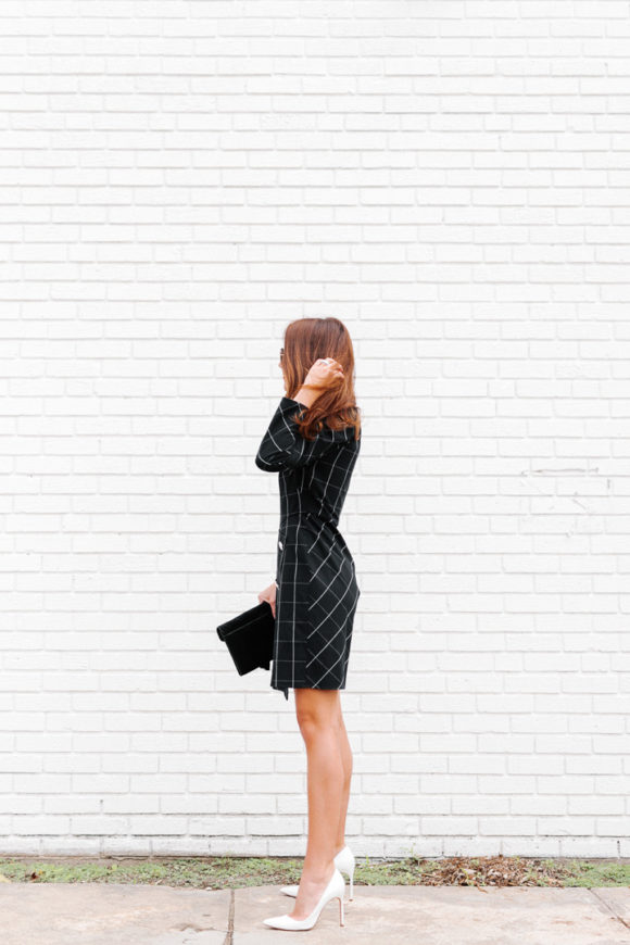 Amy Havins wears a black contrast plaid shoshanna dress.