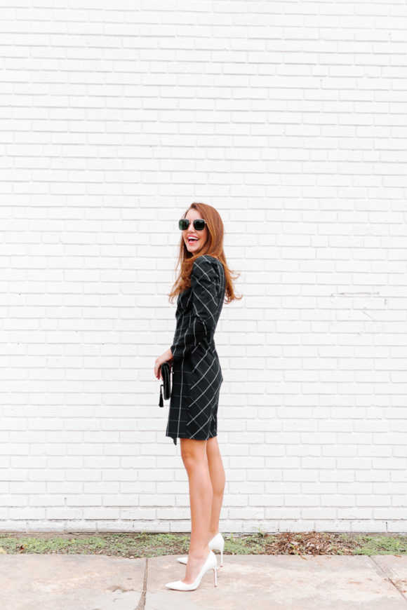 Amy Havins wears a black contrast plaid shoshanna dress.