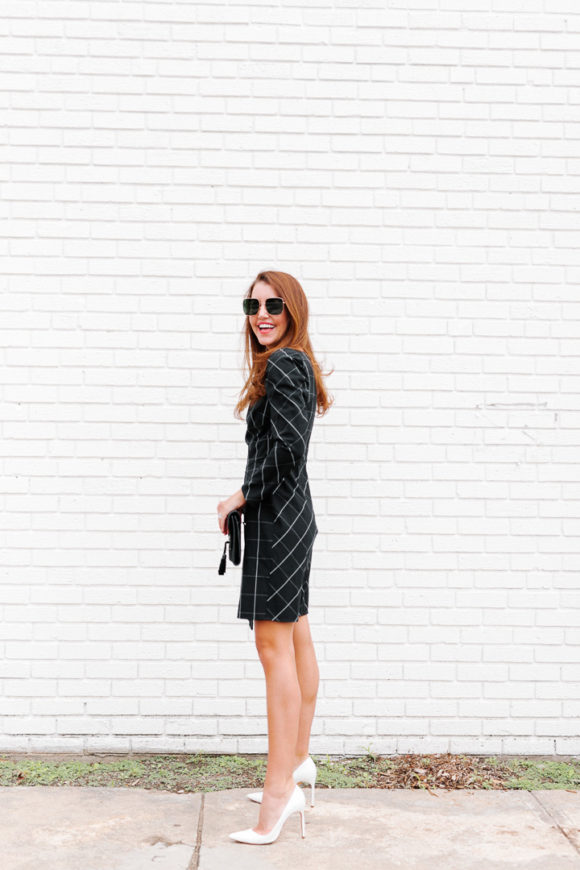 Amy Havins wears a black contrast plaid shoshanna dress.