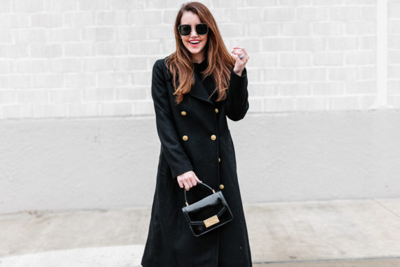 Amy Havins wears a black ralph lauren coat.