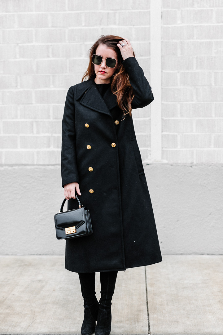 Amy Havins wears a black ralph lauren coat.