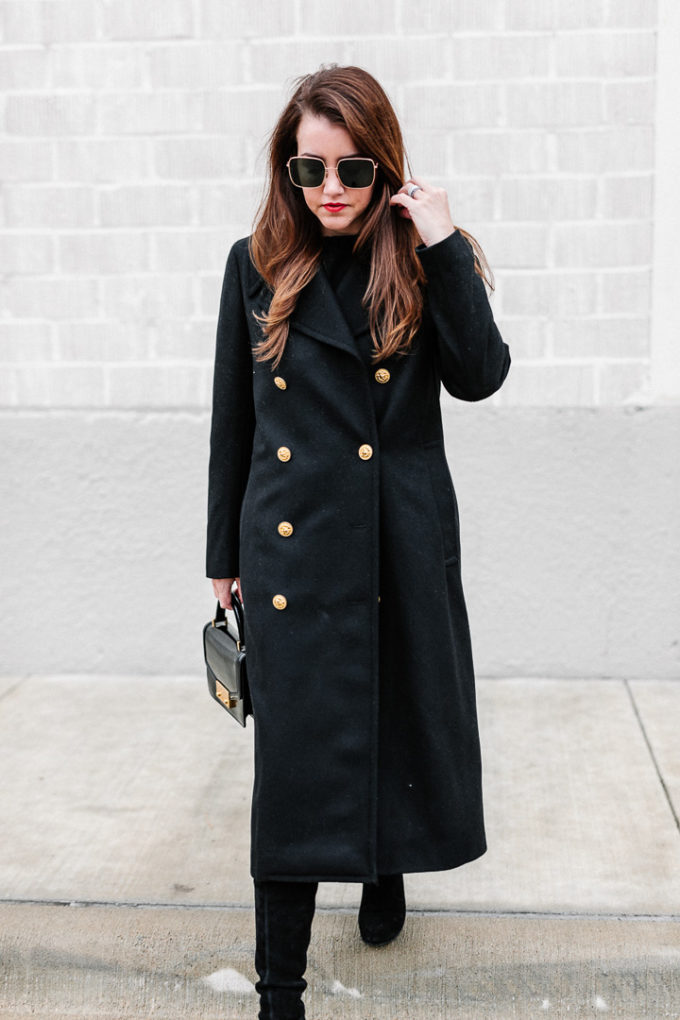 Amy Havins wears a black ralph lauren coat.