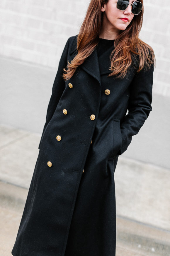 Amy Havins wears a black ralph lauren coat.