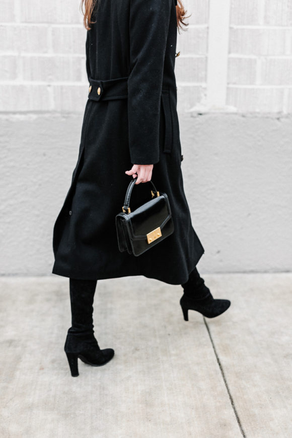Amy Havins wears a black ralph lauren coat.
