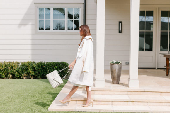 Amy havins wears an all white outfit.